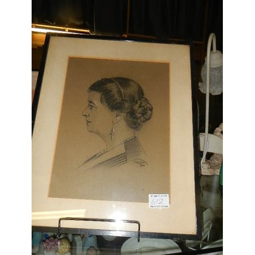 612 - A framed and glazed pencil portrait drawing.