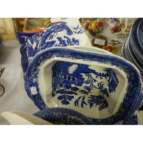 614 - Approximately 40 pieces of blue and white dinner ware.