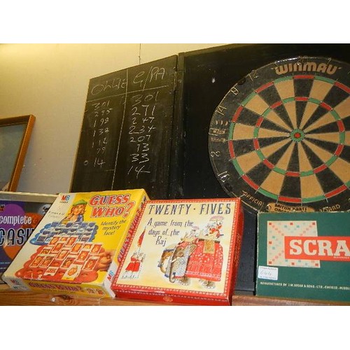 644 - A dart board and other games.