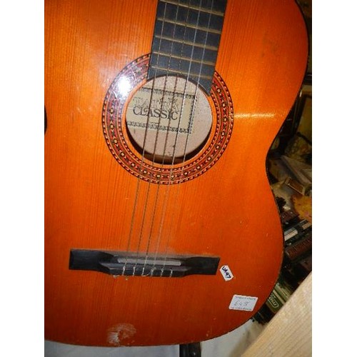 648 - A 'Classic' accoustic guitar. Has a split down the side