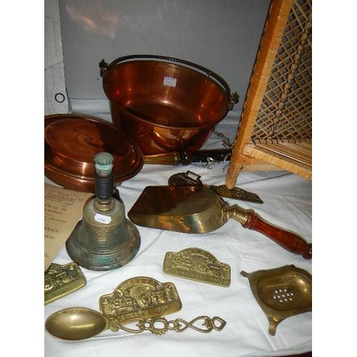 664 - A good lot of brass and copper including jam pan, warming pan etc.,