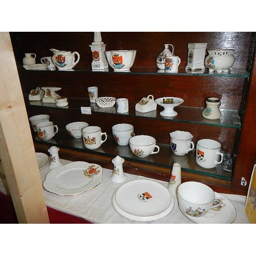 666 - A mixed lot of crested china.