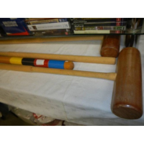 672 - A KTG croquet set with four mallets.