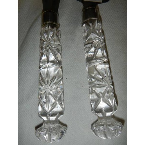 689 - A pair of cake servers with cut glass handles.