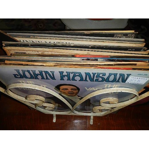 518 - A mixed lot of LP records in wrought iron rack.