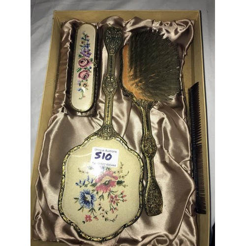 510 - A boxed dressing table set.