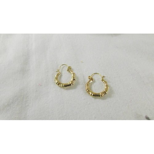 1008 - Three pairs of 9ct gold earrings, 3.4 grams.