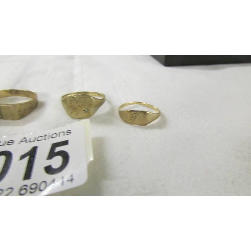 1015 - Four 9ct gold rings, sizes J, Q, R and X, 9.6 grams.