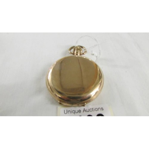 1102 - A gold plated full hunter pocket watch marked Dennison Watch Case Co., Ltd., In working order.