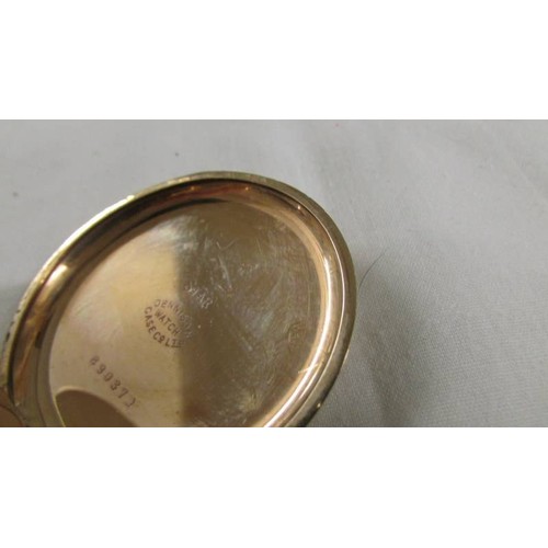 1102 - A gold plated full hunter pocket watch marked Dennison Watch Case Co., Ltd., In working order.