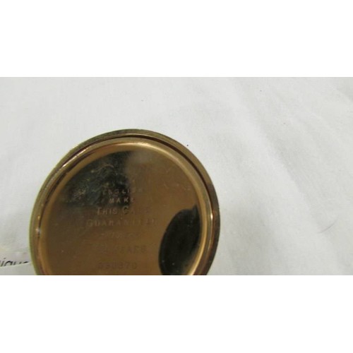 1102 - A gold plated full hunter pocket watch marked Dennison Watch Case Co., Ltd., In working order.