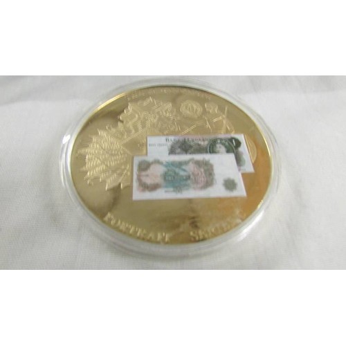 1156 - Three bank note commemorative coins, £1 No.06618, £5 No.02107 & £50 No.06034. all gold plated.