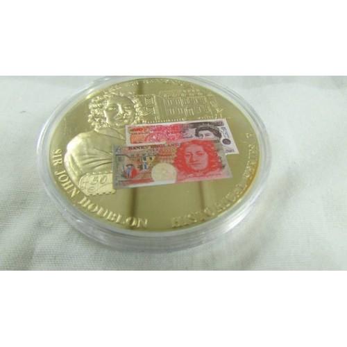 1156 - Three bank note commemorative coins, £1 No.06618, £5 No.02107 & £50 No.06034. all gold plated.