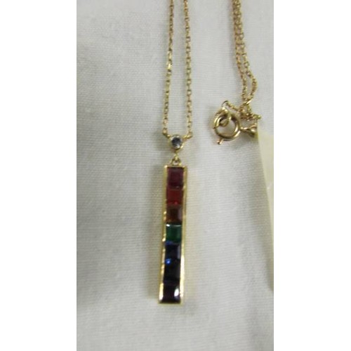 1036 - An 18ct yellow gold diamond/sapphire/emerald pendant.