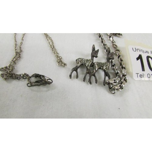 1046 - A silver marcasite deer pendant and 2 silver chains.