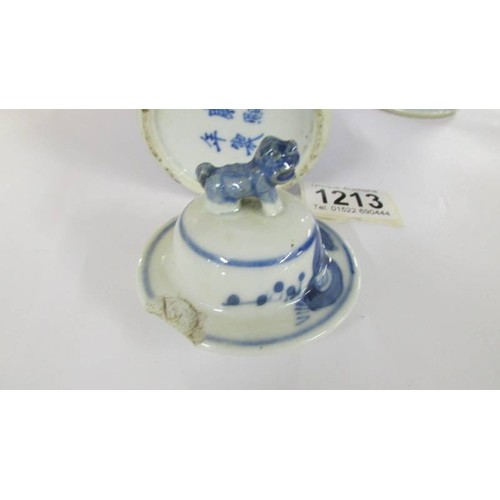 1213 - A pair of early Chinese blue & white lidded vases (both lids a/f) and a blue and white flask.