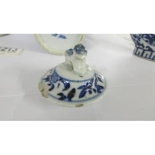 1213 - A pair of early Chinese blue & white lidded vases (both lids a/f) and a blue and white flask.