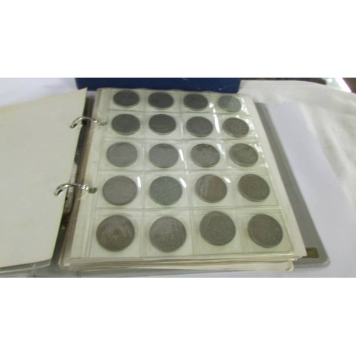 1171 - Two albums of UK and foreign coins.