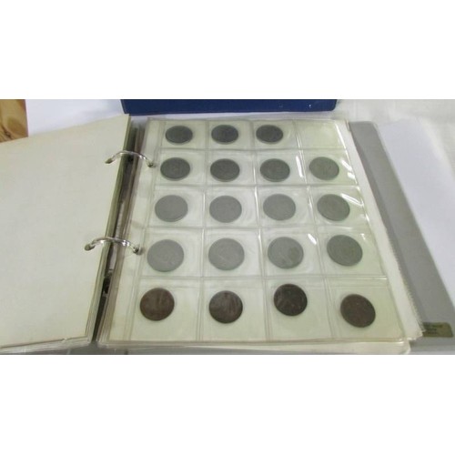 1171 - Two albums of UK and foreign coins.