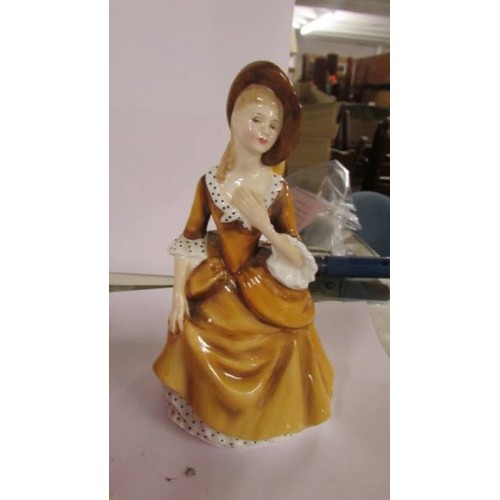 1231 - Two Royal Doulton figurines, Belle HN4235 and Sandra HN2275.