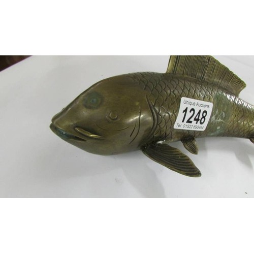 1248 - A bronze Koi carp, 30 cm long.