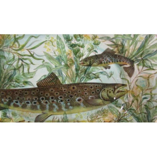 1263 - An oval platter decorated with pike by House of Stewart, 40 cm x 31 cm.