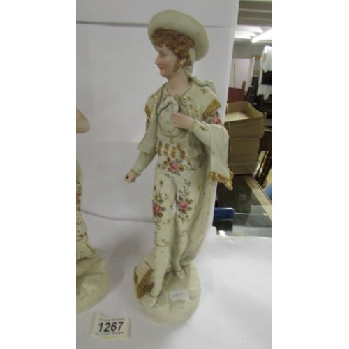 1267 - A good pair of Continental porcelain figures, 34 cm tall.  (There is something missing from the man'... 