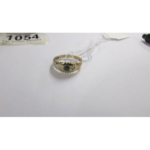 1054 - A 9ct gold ring, size O.  1.9 grams.