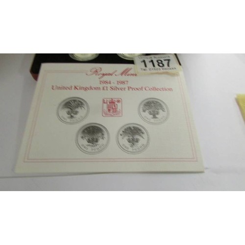 1187 - A cased Royal Mint 1984 - 1987 Uk £1 silver proof collection.