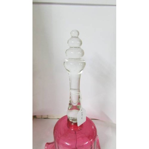 1271 - A Victorian cranberry glass bell in good condition.