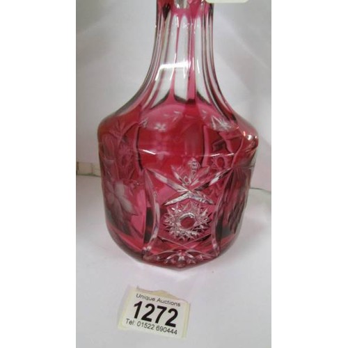 1272 - A red overlaid cut glass decanter.