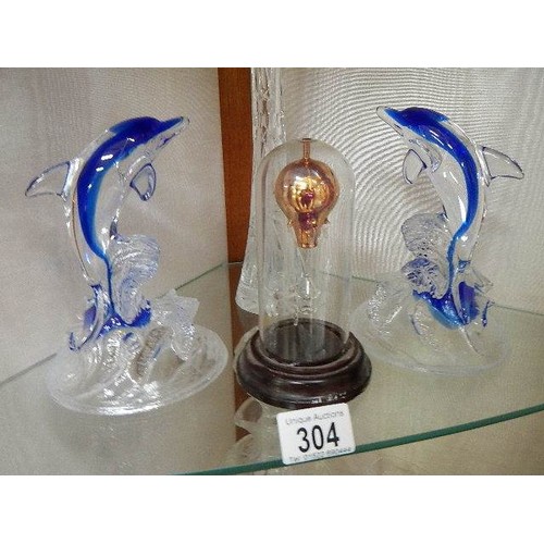 304 - Two glass dolphins, a cut glass vase and a glass hot air balloon under dome.