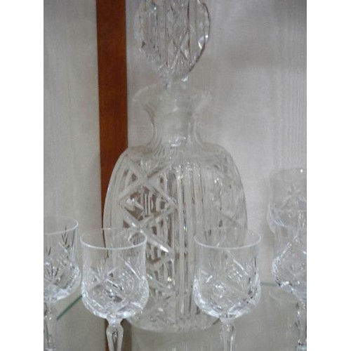 305 - A good quality mid 20C oval cut glass decanter and six glasses.   COLLECT ONLY.