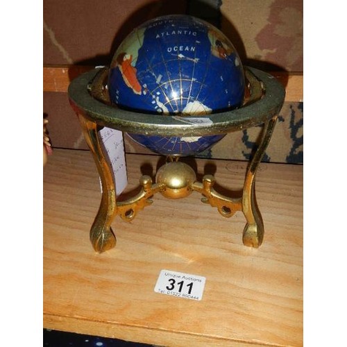 311 - A jewelled globe on stand.