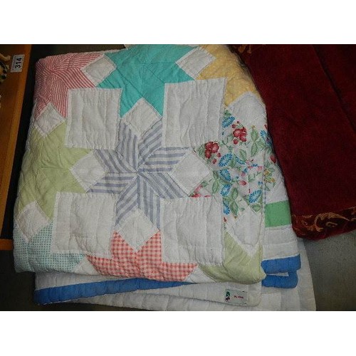 324 - A good quality quilt and a patchwork quilt.