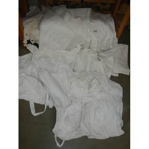 325 - A mixed lot of white linen including two Victorian petticoats.