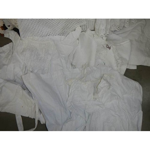 325 - A mixed lot of white linen including two Victorian petticoats.