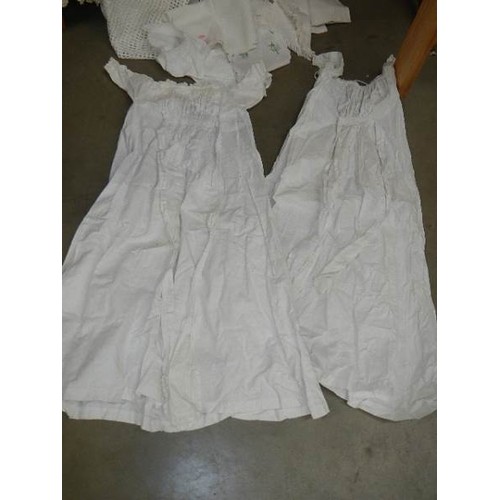 325 - A mixed lot of white linen including two Victorian petticoats.