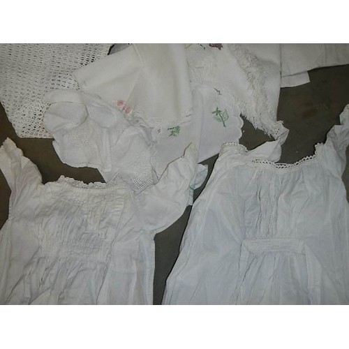 325 - A mixed lot of white linen including two Victorian petticoats.