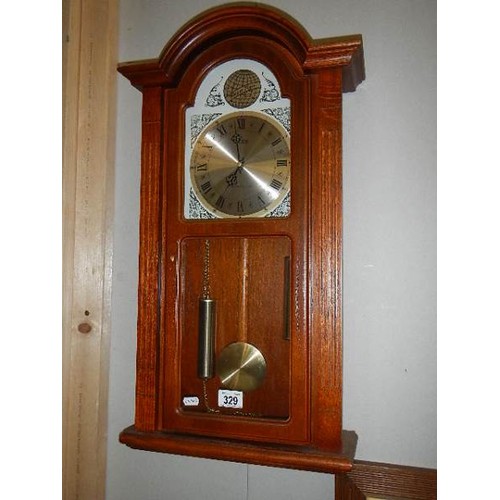 329 - A battery operated wall clock, (needs new battery).   COLLECT ONLY.