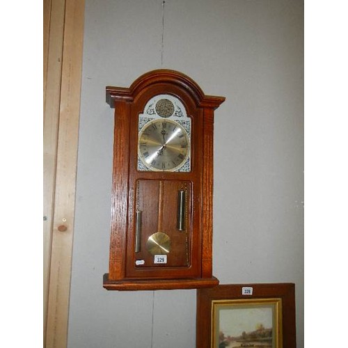 329 - A battery operated wall clock, (needs new battery).   COLLECT ONLY.