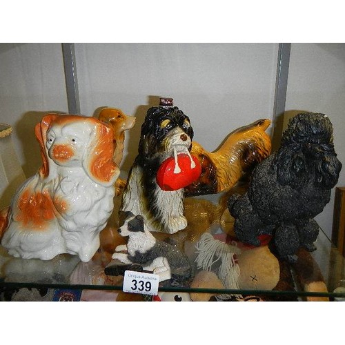 339 - A decanter in the form of a dog and other dog figures.