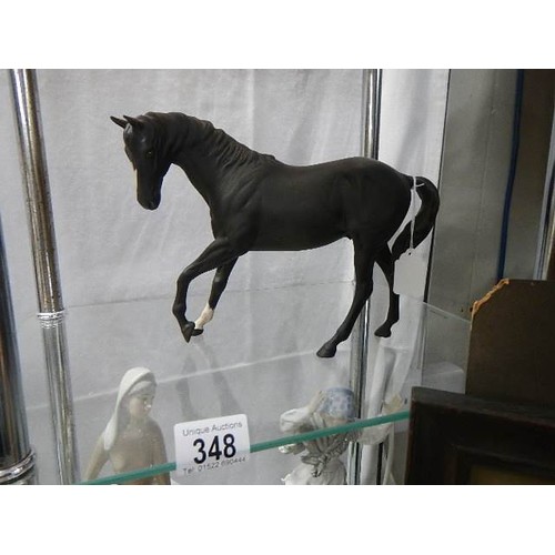 348 - A Royal Doulton black horse.