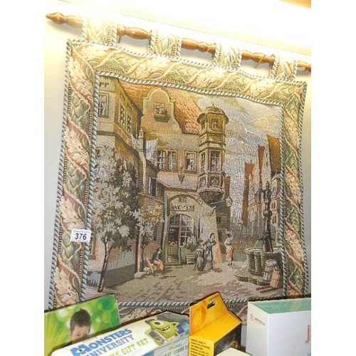 376 - A tapestry wall hanging of a classical Italian? street scene, 58 x 64 cm.