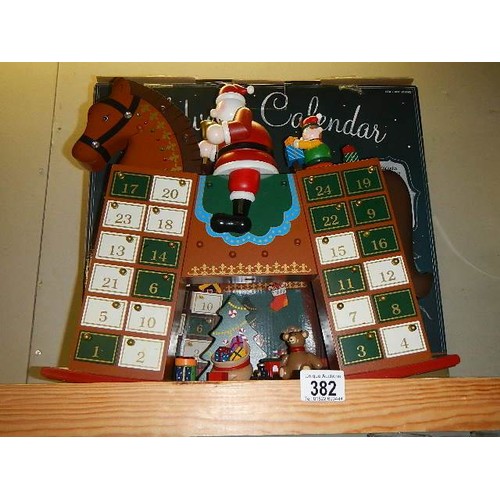 382 - A boxed rocking horse advent calendar.