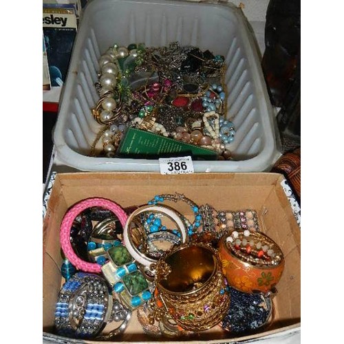 386 - Two boxes of costume jewellery.