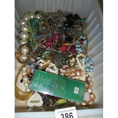 386 - Two boxes of costume jewellery.