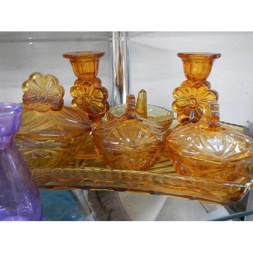 401 - An art deco amber glass trinket set and three small glass vases.