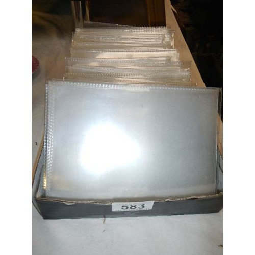 A box of plastic postcard sleeves.