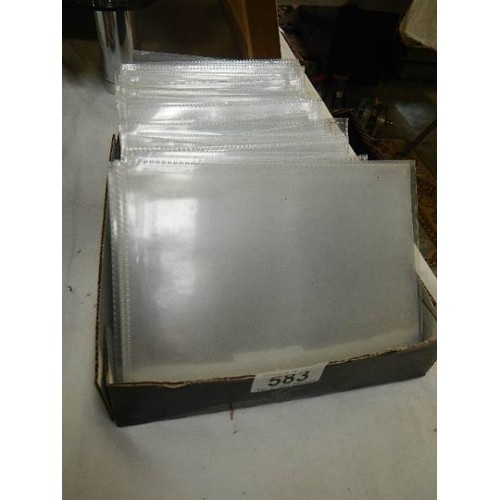 A box of plastic postcard sleeves.